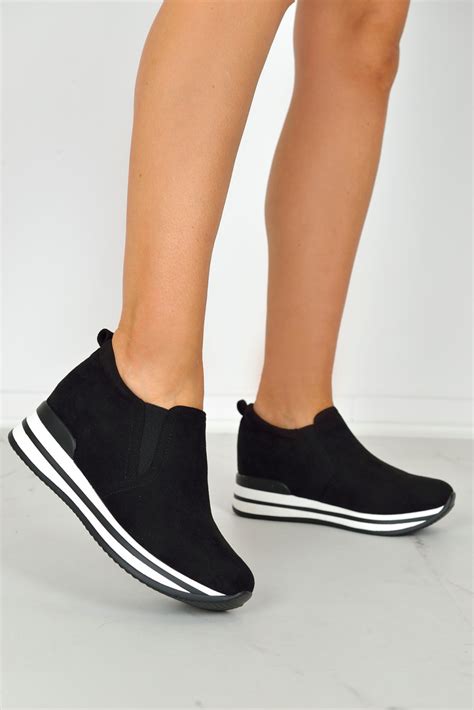 black hidden wedge sneakers.